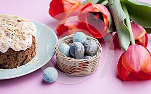 Delicious sweet homemade easter cake, tulips and eggs, top view