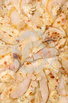 Delicious sweet pizza with pear, dorblu cheese and nuts