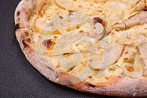 Delicious sweet pizza with pear, dorblu cheese and nuts