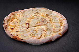 Delicious sweet pizza with pear, dorblu cheese and nuts