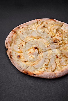 Delicious sweet pizza with pear, dorblu cheese and nuts