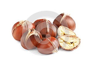 Delicious sweet roasted edible chestnuts isolated on white