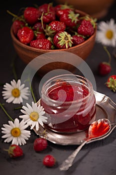 Delicious sweet strawberry jam and fresh ripe berries