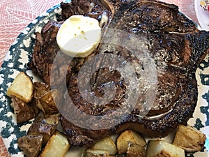 Delicious T-Bone Porterhouse Beef Stake with Compound Butter and Roasted Potatoes