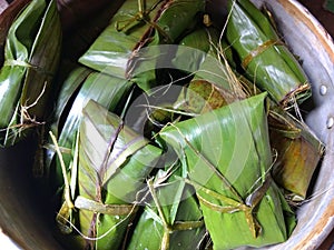 Delicious tamales wrapped with banana leaves. typical food of guatemala photo