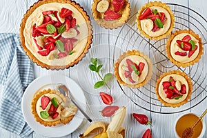 Delicious tartlets with strawberries, flat lay