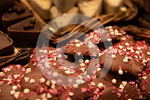Delicious and tasty sweet bar of dark chocolates with garnishes at a confectionery