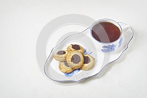 Delicious tea and biscuits with quince jam