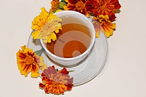 Delicious tea in a white Cup on a saucer