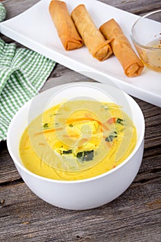 Delicious thai curry coconut chiken soup bowl