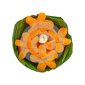 Delicious Thai desserts Flower Egg Yolk Tart, Thong yip in banana leaf basket isolated on white with clipping path photo