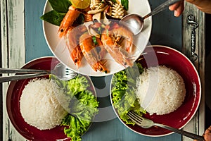 Delicious thailand food fried shrimp and squid cooked herb in di