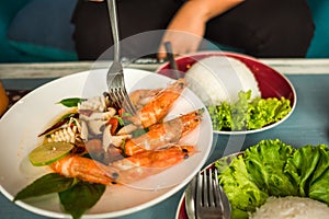 Delicious thailand food fried shrimp and squid cooked herb in di