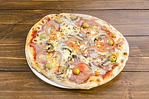 Delicious thin crust pizza with mushrooms, lots of melted cheese, flaked Parmesan