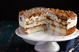 Delicious tiramisu cake on cake stand