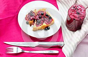 Delicious toasts bread with homemade currant jam with fork and knife