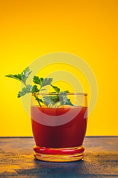 Delicious tomato bloody mary cocktail on dark blue concrete table