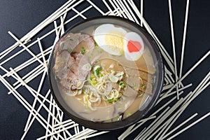 Delicious tonkotsu ramen, Japanese noodle in pork Bone based soup topped with chashu pork, boiled egg, pickled bamboo shoot