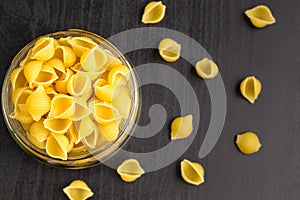 Delicious traditional conchiglie paste shells Italian macaroni pasta in the glass jar