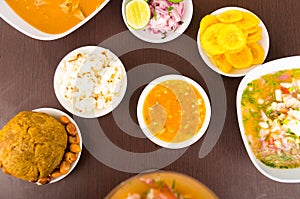 Delicious traditional food of Ecuador, aji, ceviche, pop corn, bolon and fried bananas