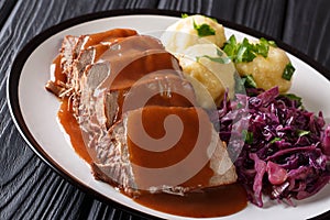 Delicious traditional German dinner Sauerbraten - slowly stewed photo