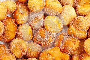 Delicious and traditional homemade Brazilian sweet called Bolinho de Chuva in close-up photo