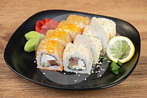 delicious traditional Japanese sushi and rolls on a plate