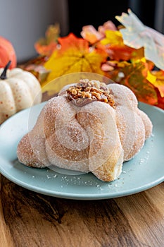 Delicious traditional mexican pan de muerto, with cajeta on top, sugar, inside a coffee, for the day of the dead, mexican culture