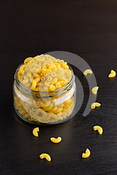 Delicious traditional pasta horns macaroni in the glass jar