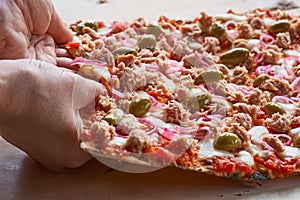 Delicious traditional Tarte Flambee from the Alsatian region of France with a thin crust of dough, tuna