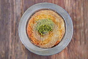 Delicious traditional Turkish dessert: Kunefe kadayif with pistachio and cheese