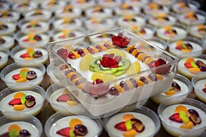 Delicious tropical fresh fruit pudding on table