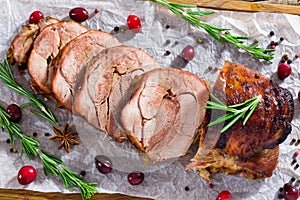 Delicious turkey meat roulade cut in slices, close-up photo