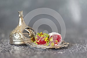 Delicious Turkish dessert called rahat locum on a small silver plate