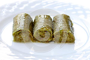 Delicious Turkish sweet, wrapped green pistachio nuts ( Sarma ) photo