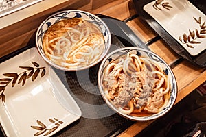Delicious udon menu served in bowls on a tray at a Japanese restaurant