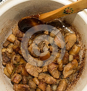 Delicious unhealthy fried pork greaves in the pan traditional Romanian Christmas dish. Jumari