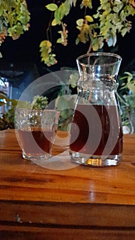 delicious v60 black coffee served on a wooden table photo