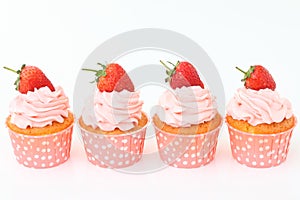 Delicious vanilla cupcake with strawberry