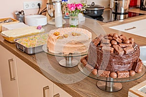 Delicious variety of cake: chocolate, vanilla, cake with confetti and three milks on the kitchen counter