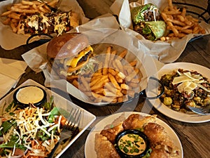Delicious Variety of Fast Food Meals on a Plates and in baskets