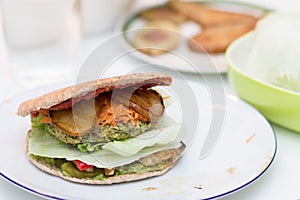 Delicious vegan burger on white plate