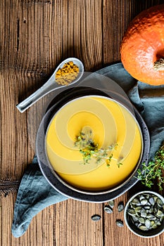 Delicious vegan creamy red lentil and pumpkin soup topped with fresh thyme