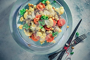 Delicious vegetable dish cauliflower baked chickpeas tomatoes