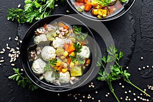 Delicious vegetable soup with chicken meatballs and pearl barley