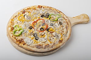 Delicious Vegetarian pizza served on wooden plate 