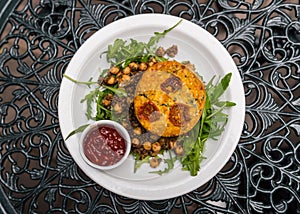 Delicious vegetarian quiche served with fresh salad and chickpeas