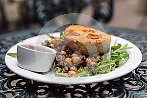 Delicious vegetarian quiche served with fresh salad and chickpeas