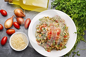 Delicious vegetarian quinoa salad with parsley, tomato and onion