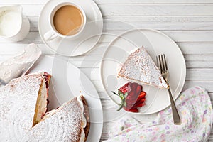 Delicious Victoria sponge cake with a cup of coffee or tea